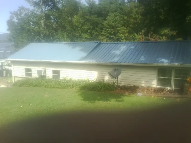 Blue metal roof running the length of a single story home in Clearfield